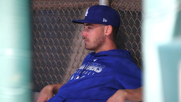 Feb 20, 2020; Glendale, Arizona, USA; Los Angeles Dodgers center fielder Cody Bellinger (35)sits in the dugout as he takes a break during spring training at Camelback Ranch. Mandatory Credit: Jayne Kamin-Oncea-USA TODAY Sports